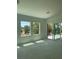 Sun-filled living room featuring natural lighting and large windows and sliding glass door at 8721 Robinson Ridge Dr, Las Vegas, NV 89117