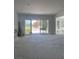 Spacious living room features sliding glass doors that provide lots of natural light at 8721 Robinson Ridge Dr, Las Vegas, NV 89117