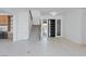 Bright, open-concept living room features tile floors, modern staircase, and stylish front door at 8721 Robinson Ridge Dr, Las Vegas, NV 89117