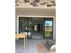 Covered patio featuring sliding glass doors and stone accents at 8721 Robinson Ridge Dr, Las Vegas, NV 89117