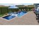 Backyard pool with patio, in-pool loungers and landscaping at 8721 Robinson Ridge Dr, Las Vegas, NV 89117