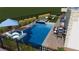 A clear shot of the pool features a swim up bar, hot tub, lounge chairs, and outdoor kitchen at 8721 Robinson Ridge Dr, Las Vegas, NV 89117