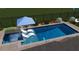 Aerial view of a pool with an umbrella, chairs, and landscape at 8721 Robinson Ridge Dr, Las Vegas, NV 89117