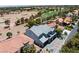 Two-story home with stone accents, a three-car garage, and an expansive golf course view at 8721 Robinson Ridge Dr, Las Vegas, NV 89117