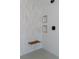Modern shower features sleek tile, black hardware, a built-in seat, and recessed shelving at 8721 Robinson Ridge Dr, Las Vegas, NV 89117