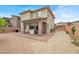 Large backyard offering desert landscaping and a covered patio at 8870 Sasquatch Run Ave, Las Vegas, NV 89166