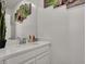 A modern bathroom with marble countertops and decorative wall art at 8870 Sasquatch Run Ave, Las Vegas, NV 89166