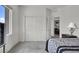 This bedroom offers a spacious closet with contemporary doors at 8870 Sasquatch Run Ave, Las Vegas, NV 89166