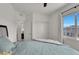 Bright bedroom with a ceiling fan and a view of the neighborhood at 8870 Sasquatch Run Ave, Las Vegas, NV 89166