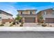 Charming two-story home with a well-maintained front yard and brick driveway at 8870 Sasquatch Run Ave, Las Vegas, NV 89166