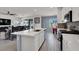 Bright, open-concept kitchen flows into the living area with a large island and stainless steel appliances at 8870 Sasquatch Run Ave, Las Vegas, NV 89166
