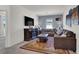 Comfortable living room with plush seating and a decorative fireplace at 8870 Sasquatch Run Ave, Las Vegas, NV 89166