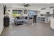Spacious living room that has a plush grey sofa with hardwood floors at 8870 Sasquatch Run Ave, Las Vegas, NV 89166