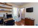 This bedroom includes built-in shelving, hardwood floors, and a convenient workspace at 915 Graceful Moon Ave, Henderson, NV 89015