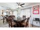 Well-lit dining room with mirrored wall, and contemporary ceiling fan at 915 Graceful Moon Ave, Henderson, NV 89015