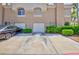 Charming townhome featuring two-car garage and well-maintained landscaping at 915 Graceful Moon Ave, Henderson, NV 89015
