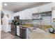 Updated kitchen with granite countertops and stainless steel appliances at 915 Graceful Moon Ave, Henderson, NV 89015