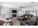 Comfortable living room with fireplace, ceiling fan and lots of natural light at 915 Graceful Moon Ave, Henderson, NV 89015