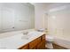 Bathroom with a single sink, white vanity and a tub shower combo at 925 Crescent Falls St, Henderson, NV 89011