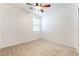 Standard carpeted bedroom featuring a window and ceiling fan at 925 Crescent Falls St, Henderson, NV 89011