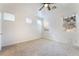 Bright bedroom with neutral carpet and multiple windows providing ample natural light at 925 Crescent Falls St, Henderson, NV 89011