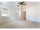 Bedroom featuring neutral carpet, bright windows and a ceiling fan at 925 Crescent Falls St, Henderson, NV 89011
