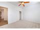 Bedroom features neutral carpet, ceiling fan and walk-in closet at 925 Crescent Falls St, Henderson, NV 89011