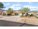 Beautiful single-story home with desert landscaping, spacious driveway, and attached two-car garage at 925 Crescent Falls St, Henderson, NV 89011
