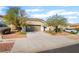 Charming single-story home featuring a desert landscape, a two-car garage, and a concrete driveway at 925 Crescent Falls St, Henderson, NV 89011
