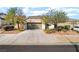 Charming single-story home with desert landscaping, two-car garage and concrete driveway at 925 Crescent Falls St, Henderson, NV 89011