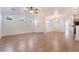 Spacious living area with beautiful wood-look tile flooring and abundant natural light at 925 Crescent Falls St, Henderson, NV 89011
