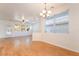 Open-concept living room with tile floors, fan and lots of natural light at 925 Crescent Falls St, Henderson, NV 89011