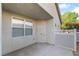 Cozy outdoor patio area with a secure door and access to a gated backyard space at 925 Crescent Falls St, Henderson, NV 89011