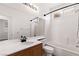 Standard bathroom with white tile, shower-tub combination and window at 9630 Tuscola Ct, Las Vegas, NV 89148