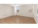 Bright bedroom with wood floors, neutral walls, and windows creating ample natural light at 9630 Tuscola Ct, Las Vegas, NV 89148