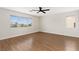Spacious bedroom with vinyl floors, ceiling fan, and large windows providing natural light at 9630 Tuscola Ct, Las Vegas, NV 89148