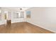 Bright living room featuring wood floors, large window, and open layout design at 9630 Tuscola Ct, Las Vegas, NV 89148