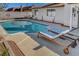 Beautiful backyard pool with lounge chairs and landscaped surroundings at 976 El Camino Way, Boulder City, NV 89005