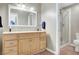 Spacious bathroom with a double vanity, ample storage, and a glass-enclosed shower at 976 El Camino Way, Boulder City, NV 89005