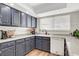 Bright kitchen with shaker cabinets, modern appliances, and a large window above the sink at 976 El Camino Way, Boulder City, NV 89005