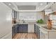 Well-lit kitchen featuring shaker cabinets, recessed lighting, and ample countertop space at 976 El Camino Way, Boulder City, NV 89005