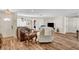 Cozy living room featuring hardwood floors, comfortable seating, and plenty of natural light for a welcoming ambiance at 976 El Camino Way, Boulder City, NV 89005