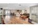 Open-concept living room featuring modern decor, wood floors, and a cozy seating area at 976 El Camino Way, Boulder City, NV 89005