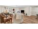 Bright living room with hardwood floors, cozy furniture, and a TV area, perfect for relaxation and entertainment at 976 El Camino Way, Boulder City, NV 89005