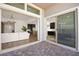 View of the back patio and yard from inside through sliding glass doors at 9815 Evergreen Pine St, Las Vegas, NV 89166
