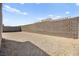 The backyard is dirt and surrounded by a block wall for privacy at 9815 Evergreen Pine St, Las Vegas, NV 89166