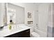 Bathroom featuring a vanity with double sinks, a tub, and a shower at 9815 Evergreen Pine St, Las Vegas, NV 89166