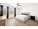 Serene bedroom featuring a neutral color palette, ample natural light, and modern furnishings at 9815 Evergreen Pine St, Las Vegas, NV 89166