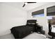 Cozy bedroom featuring a queen bed, ceiling fan, and a desk with a computer for work or gaming at 9815 Evergreen Pine St, Las Vegas, NV 89166