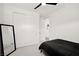 Bedroom with white walls, closet, door, ceiling fan, and carpet at 9815 Evergreen Pine St, Las Vegas, NV 89166